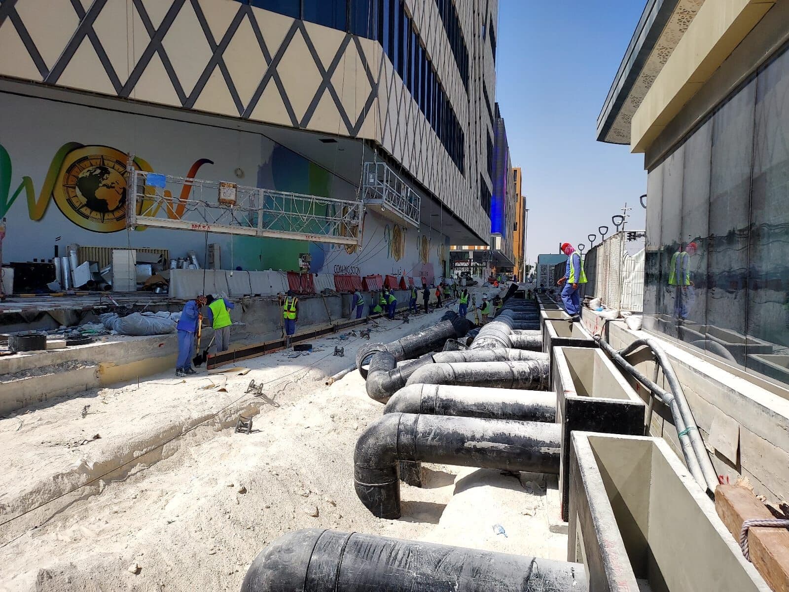 Chilled-water pipework being laid along Lusail's Commercial Boulevard